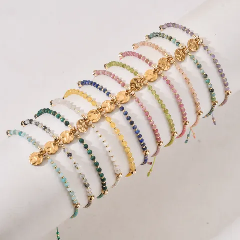 18ct gold plated disc with gemstones