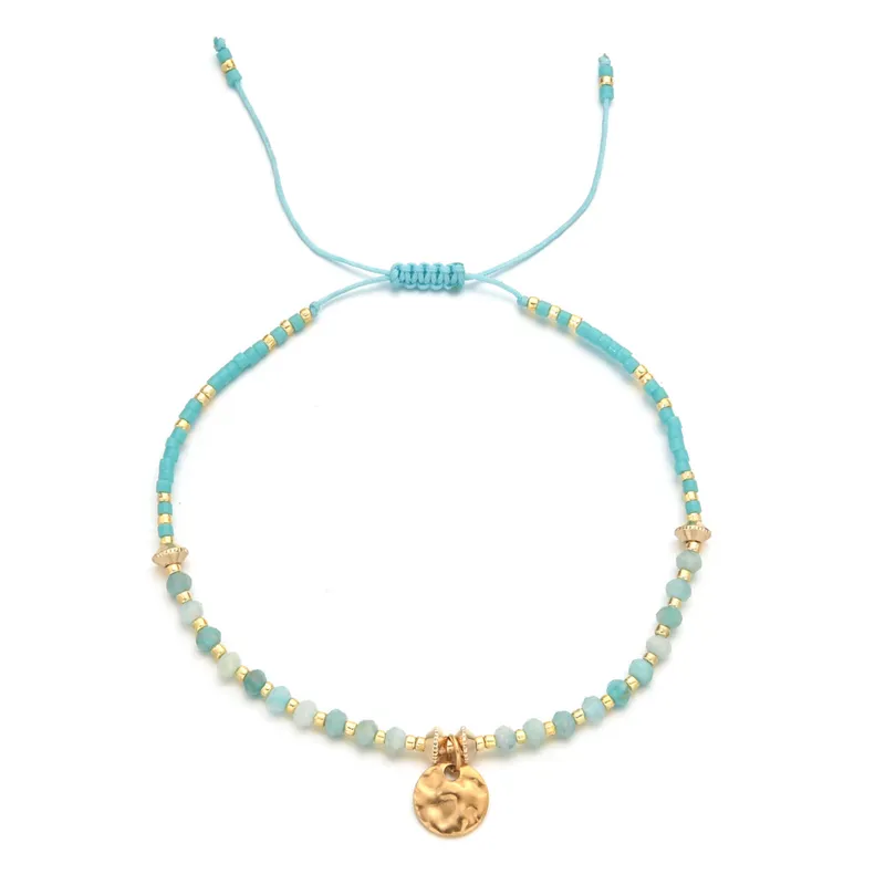 18ct gold plated disc with gemstones