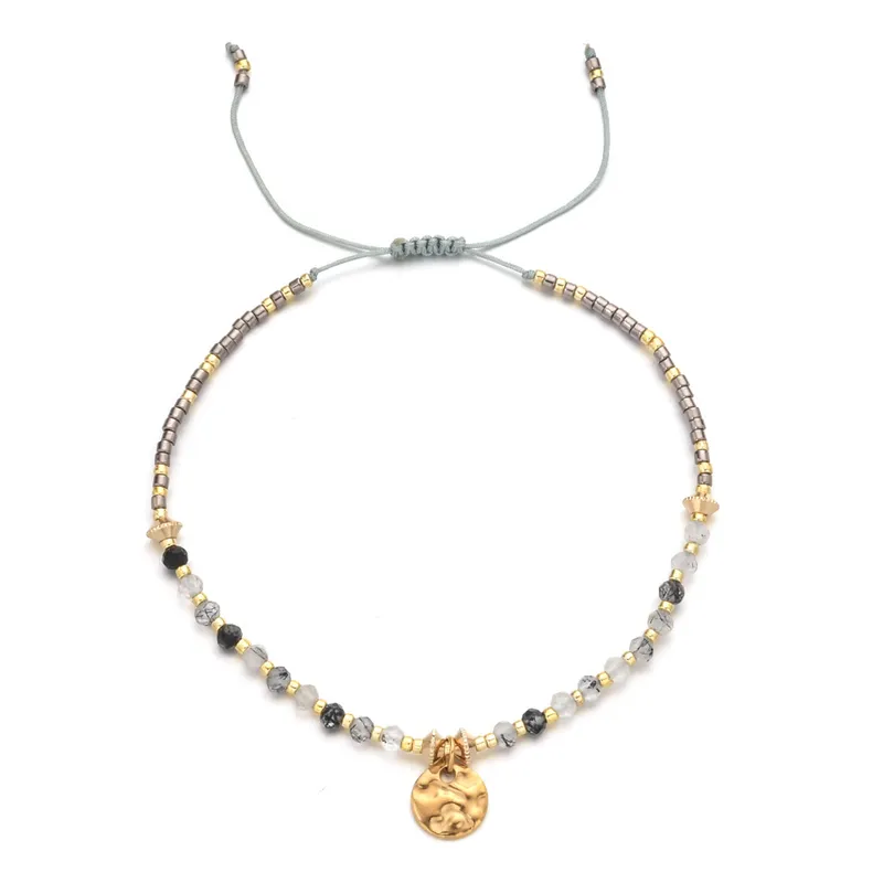 18ct gold plated disc with gemstones