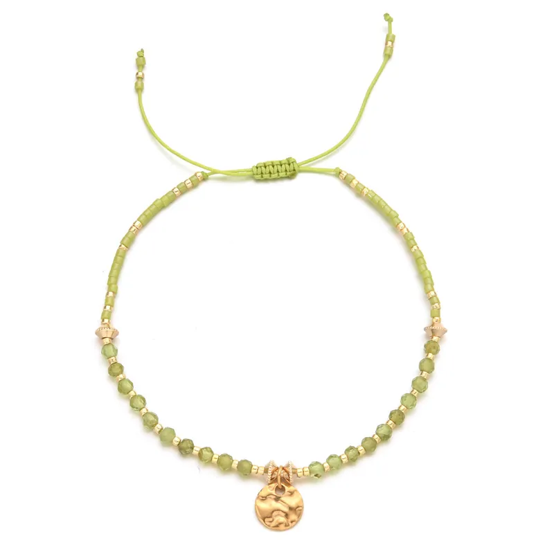 18ct gold plated disc with gemstones