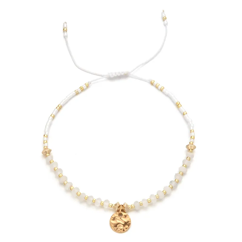 18ct gold plated disc with gemstones