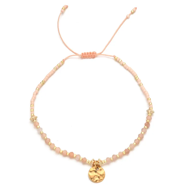 18ct gold plated disc with gemstones