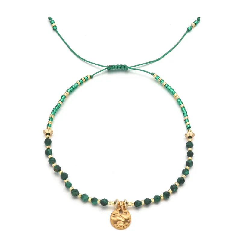 18ct gold plated disc with gemstones