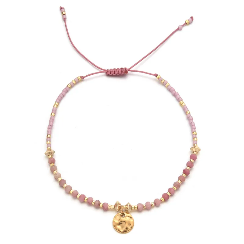 18ct gold plated disc with gemstones