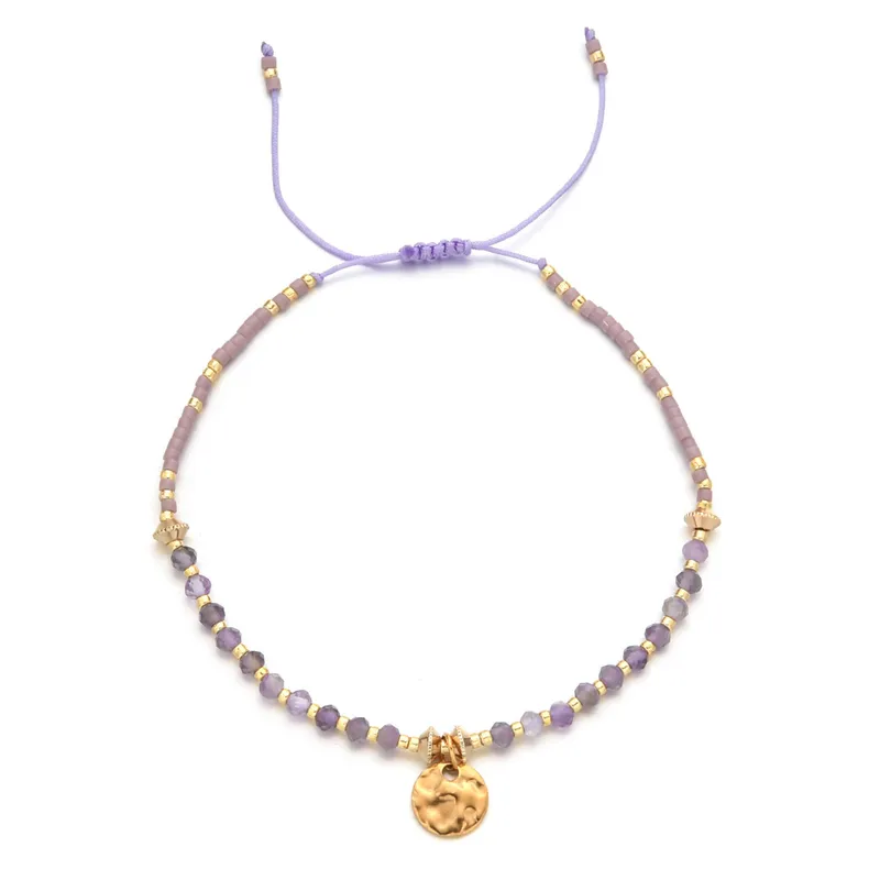 18ct gold plated disc with gemstones