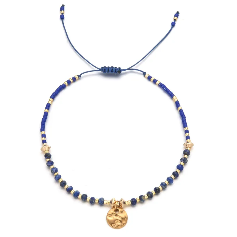 18ct gold plated disc with gemstones
