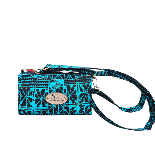 Blue and black patterned handbag with a strap on a white background