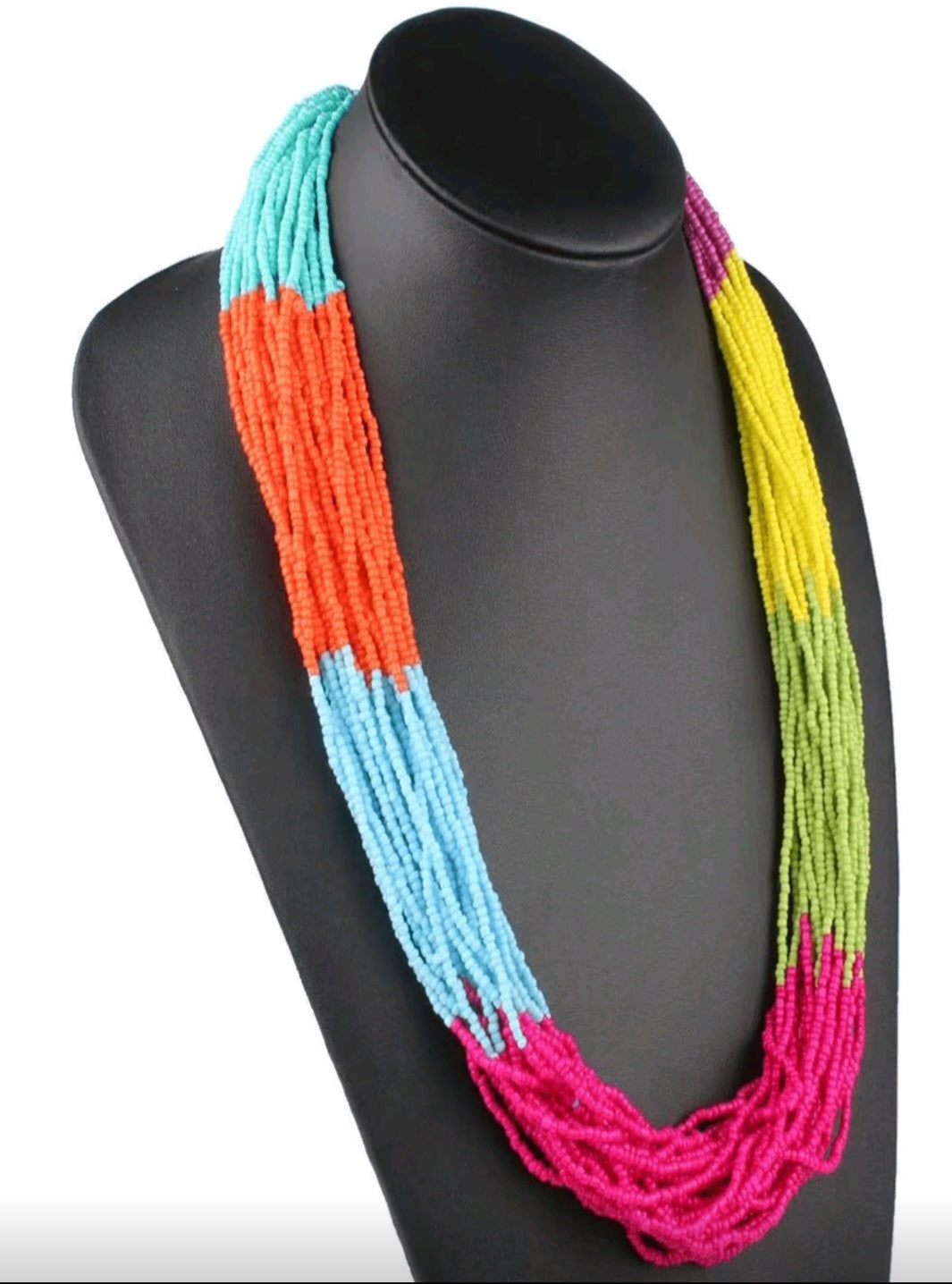 Colorful beaded necklace on a black mannequin