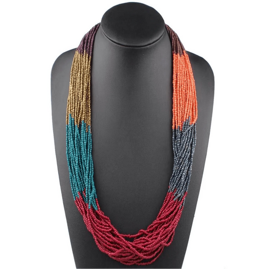 Multicolored beaded necklace on a black mannequin